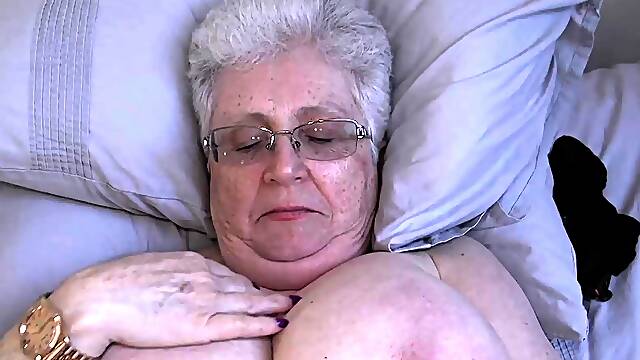 Grey granny Caroline V plays with huge tits and toys pussy