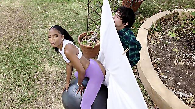 Black yoga milf lost in lust for young white cock outside