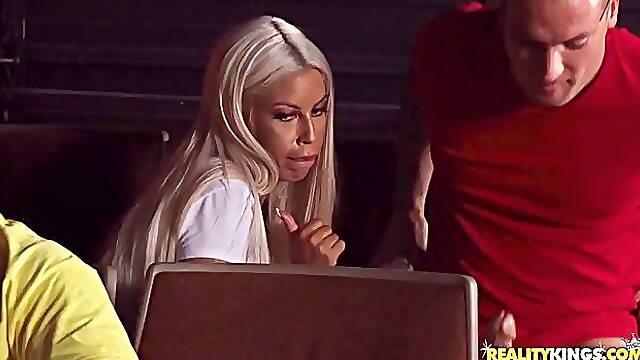 Bridgette B is having casual sex with Sean, in a private cinema, surrounded by other people