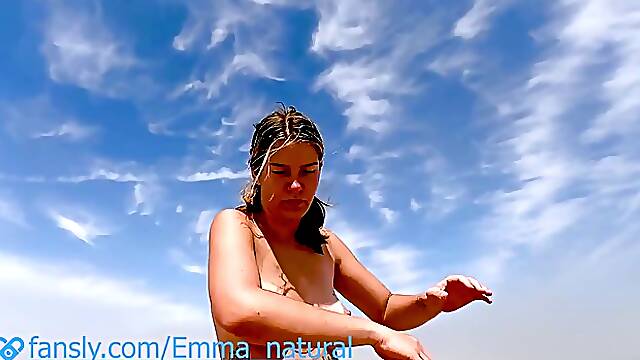 Tanned Emma decided to do Yoga on a public beach