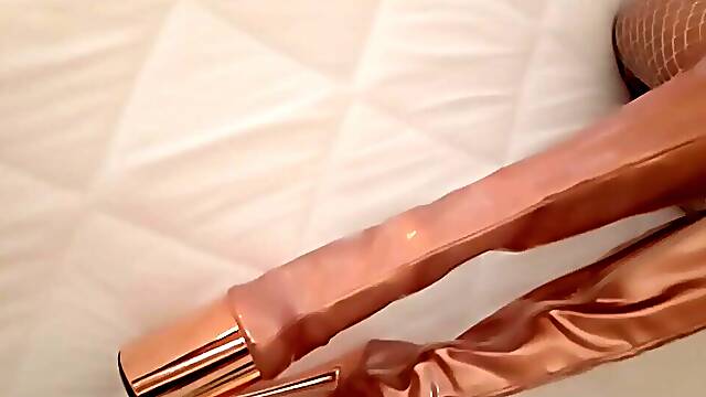 Gold knee high boots, fishnet nylons, micro petticoat and a white mini top