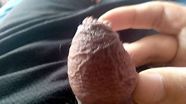 Man with a very thick penis masturbates with gusto