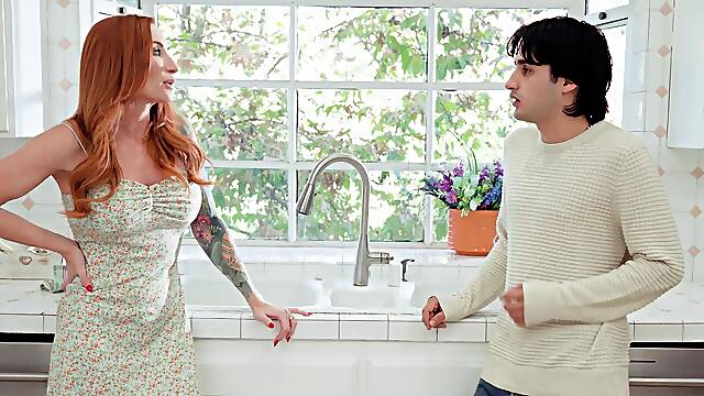 The red-haired beauty Sophia Locke fucks away with her man in the kitchen.
